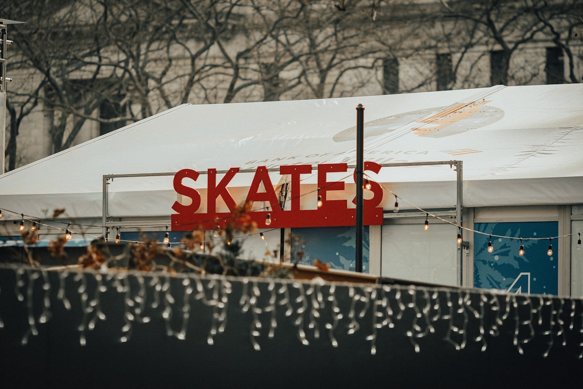 a sign that says skates on the side of a building