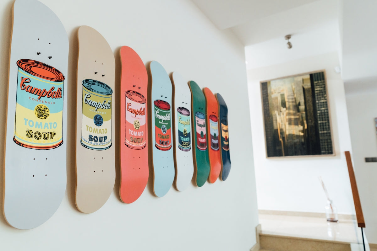 a row of skateboards mounted to a wall