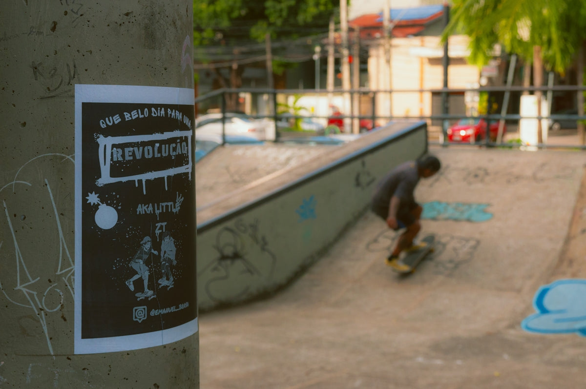 A man riding a skateboard down the side of a ramp
