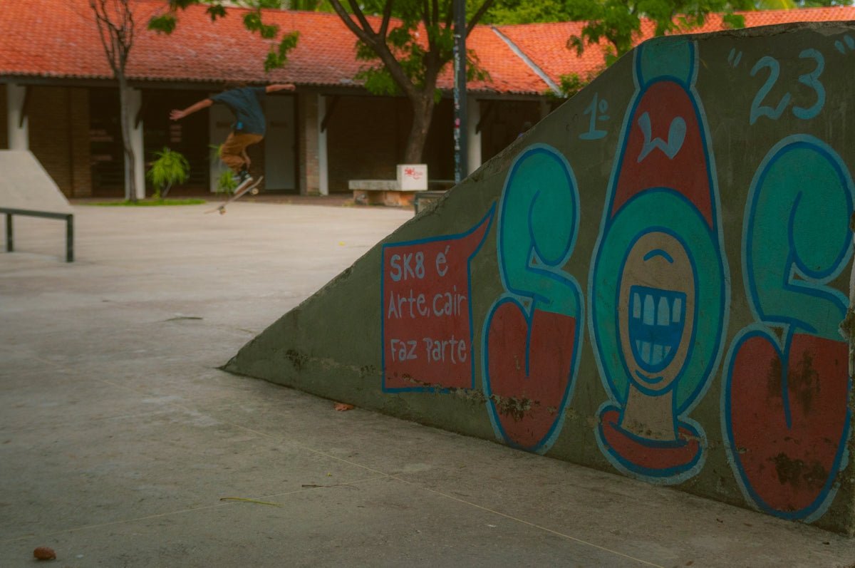 A man riding a skateboard up the side of a ramp