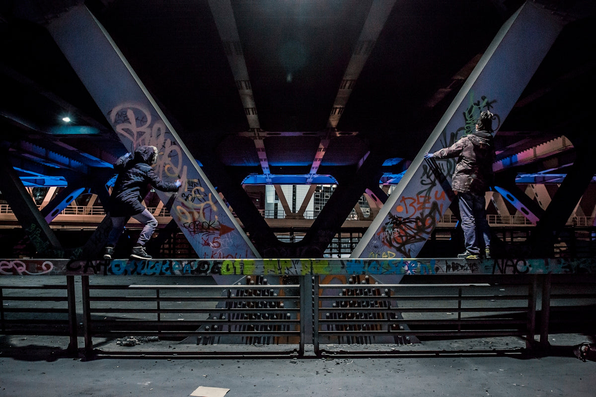 A group of people riding skateboards on top of a ramp