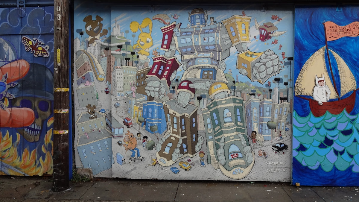 Whimsical mural depicts a surreal cityscape with cartoonish buildings.